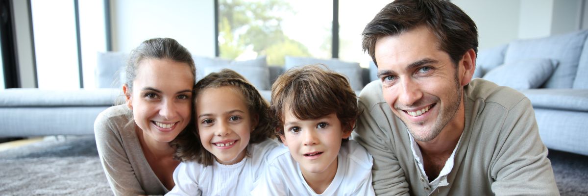 Family at home relaxing on carpet